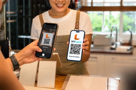Customer receiving phone at counter